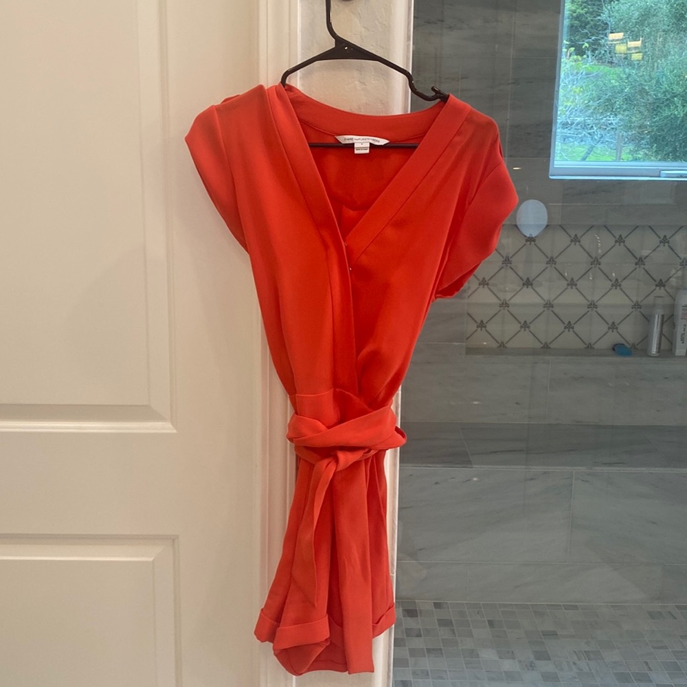 DVF romper like New! Only worn once briefly. Color is coral/orange.